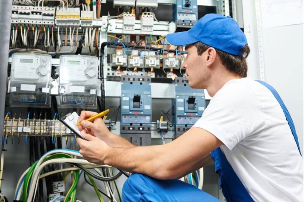 Electrician Documenting Panel Data Blue Cap