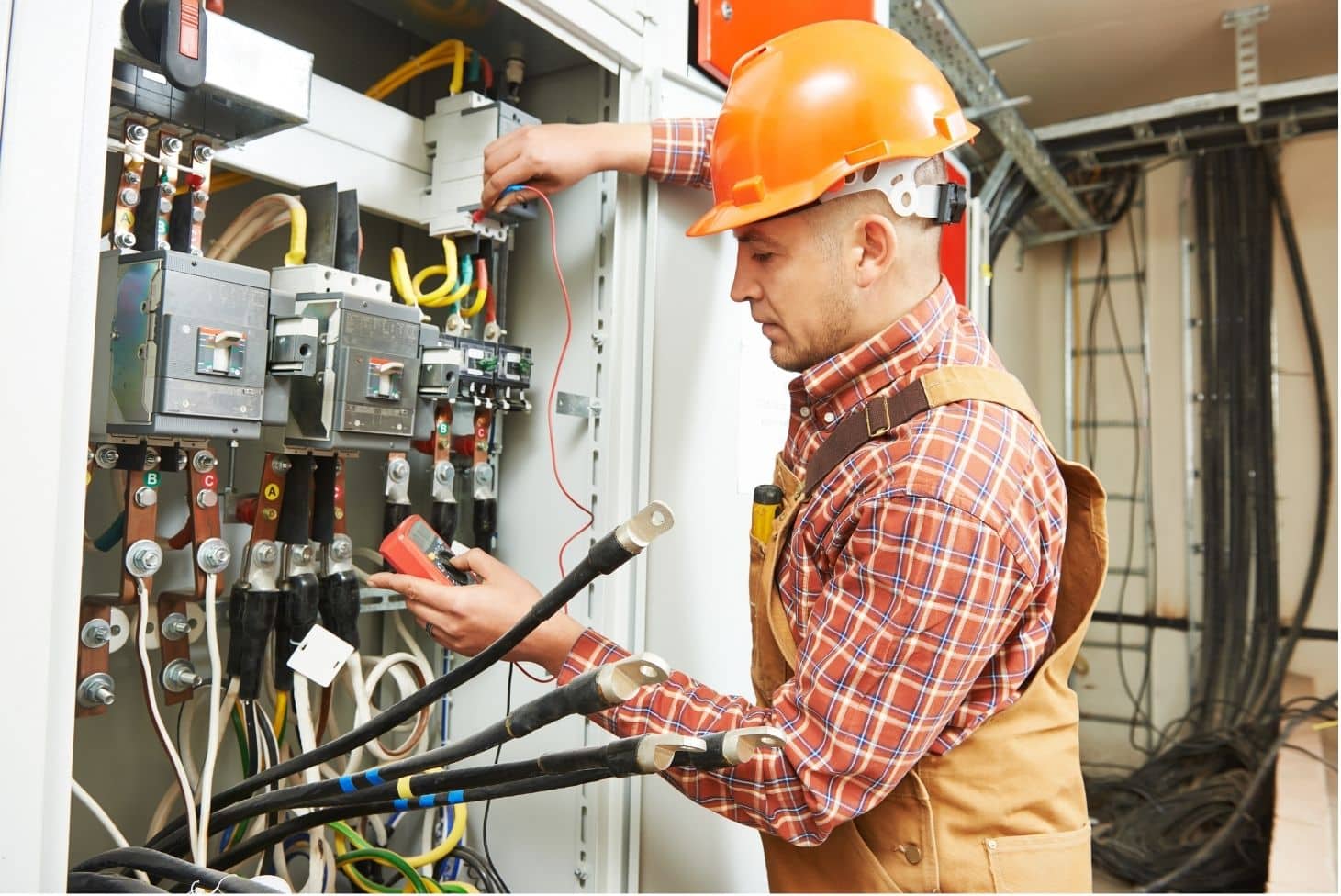Electrician Testing Circuit Breakers With Multimeter